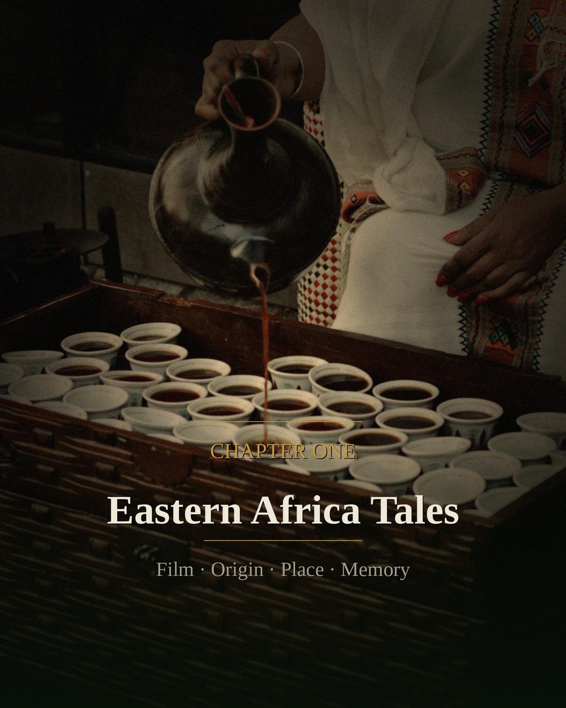 Hands pouring from a clay jebena into rows of small cups on a woven tray, rich embroidered textiles in the background, with Eastern Africa Tales chapter title